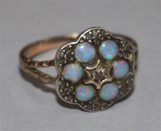 A late 19th century gold, white opal and diamond shaped hexagonal cluster ring, (possibly converted stick pin?), size G.
